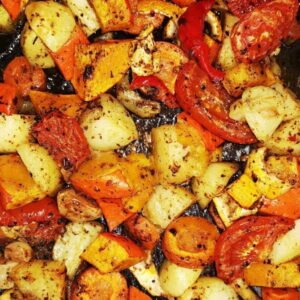 The image shows roasted vegetables, likely seasoned with herbs and oil. Roasting vegetables brings out their natural sweetness and enhances their flavor
