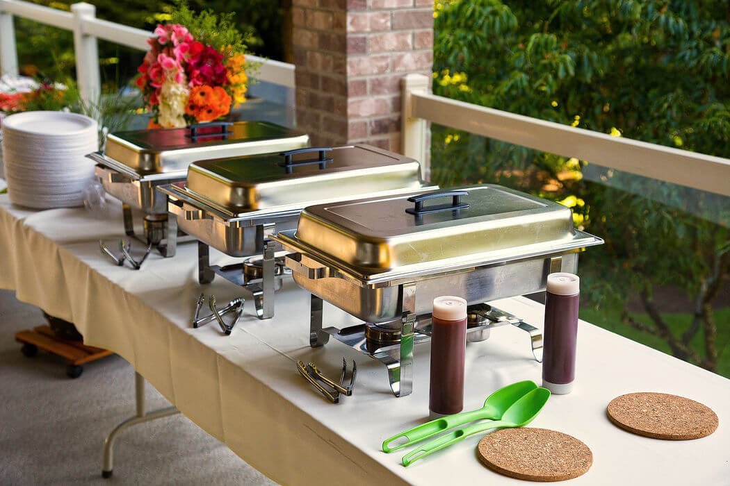 Buffet setup with chafing dishes keeping food warm—ideal for parties and celebrations. Imperial’s perfect touch for your next simcha!