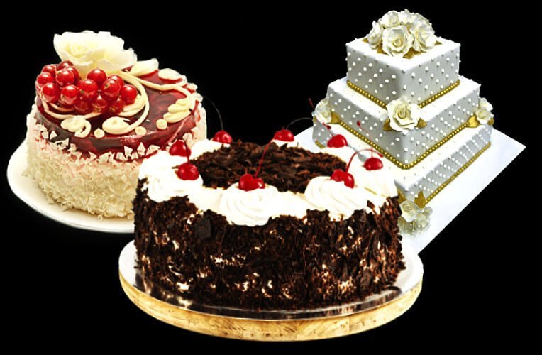 Image of three beautiful cakes: chocolate, a three-tired wedding cake and a white cake with fruit topping. They are all parve.